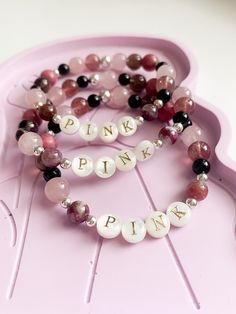 Are you going to P!NK's Summer Carnival Australian tour? Commemorate her concert experience with this luxe friendship bracelet, featuring: * mother of pearl letters * pink tourmaline * rhodonite * smoky quartz * rose quartz * strawberry quartz * black agate, and * your choice of precious metal beads. These are made to order, with an approximate dispatch time of 1-2 weeks. PERSONALISATION Add extra meaning and uniqueness to your jewels with a 14k gold filled or sterling silver charm! These are hand stamped with an uppercase initial or symbol of your choosing (only one per charm). You can purchase charms by adding them to your cart separately: https://www.etsy.com/au/listing/898692437/hand-stamped-charms-14k-gold-filled SIZING Bracelets are generally made to 7 inches (17.8cm), however refer Personalized Pink Spiritual Bracelets, Personalized Pink Spiritual Bracelet, Spiritual Personalized Pink Bracelets, Spiritual Pink Personalized Bracelets, Spiritual Personalized Pink Bracelet, Pink Natural Stone Bracelets For Friendship, Pink Beaded Bracelets With Natural Stones For Friendship, Pink Natural Stones Bracelet For Friendship, Pink Rose Quartz Bracelet For Friendship