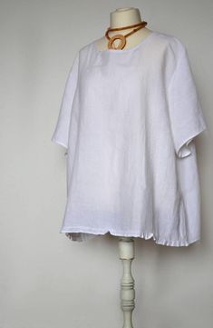 *****************************ANNOUNCEMENT: due to the summer break on 7.08-16.08.2020, please place orders after 16.08.2020. Thank you, Bożena*****************************White linen top for women.Top has round neckline and short length sleeves. On the back is a decorative fold.Very comfortable and soft natural linen top. This is the perfect women's shirt for work and beyond. Fabric: 100% linen (medium weight linen).The dimensions of the top are shown on the last photo (taken flat).If you have a Lagenlook Short Sleeve Blouse In Relaxed Fit, Linen Apron Dress, White Linen Top, Plus Size Linen, Kimono Blouse, Linen Tunic Tops, Plus Size Elegant, Blouse Plus Size, Plus Size Blouse