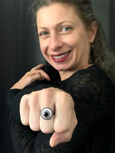 "Um... creepy. This eyeball ring stares back at you. It's a little freaky. The vintage acrylic 'eyeball' cabochon is embedded into a dark antiqued silver-gunmetal plated bezel adjustable ring. NOTE: Each vintage eyeball cabochon varies slightly, but each one is creepy-cool! -Vintage cabochon: 14mm dia (just over 1/2\") -Dark antiqued silver plated bezel: 16mm dia (approx. 5/8\" dia) -Ring size: adjustable to fit approx. 6 to 8 NOTE: The ring may be loose on smaller fingers. Shy Siren jewelry box Eyeball Ring, Creepy Eyeball, White Goth, Halloween Ring, Goth Halloween, Four Eyes, Gothic Halloween, White Eyes, Halloween Jewelry