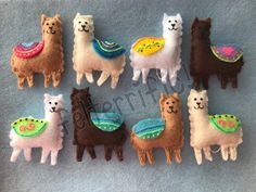 the llamas are all different colors and have been made to look like alpacas