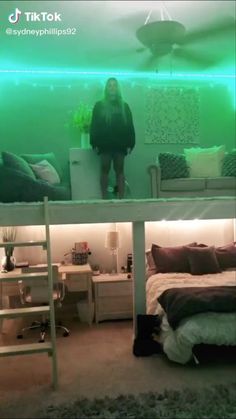 a woman standing in the middle of a room next to a bunk bed with green lights