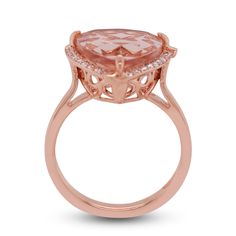 The exceptional clarity and cut of the charming Morganite are enhanced by its trillion design that rdiates a lovely pink tint. Surrounded by a halo of gorgeous round diamonds that reflect light ingeniously from their numerous facets, the beauty of this ring is truly unmatched. Crafted in 14K rose gold, its flawless finish is just what women find most irresistible. Opt for this eye-popping ring now! Product Information SKU J16761 Metal Type 14K Metal Color Rose Gold Ring Style Halo Primary Stone Formal Rose Gold Morganite Diamond Ring, Fine Jewelry Morganite Diamond Ring In Rose Gold, Luxury Rose Gold Morganite Diamond Ring, Luxury Rose Gold Topaz Ring With Prong Setting, Fine Jewelry Rose Gold Morganite Diamond Ring, Rose Gold Rings With Diamond Accents And Morganite, Luxury Rose Gold Morganite Rings, Luxury Rose Gold Topaz Ring For Wedding, Formal Morganite Rings In Pink Gold