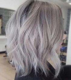 the back of a woman's head with grey hair