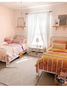 two beds in a room with white walls