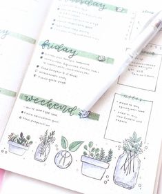 an open planner with plants and writing on it