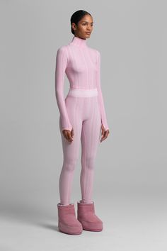 PRESALE: THIS STYLE SHIPS NOVEMBER 1 Textural vertical rib and shape wear construction complement physique while fitting flawlessly under ski suits. Top and bottom sold separately. Seamless Full-length Fitted Bottoms, Ribbed Fitted Bottoms For Winter, Chic Fitted Activewear For Loungewear, Fitted Elastane Activewear For Loungewear, Spring Compressive Ribbed Activewear, Fitted High Neck Athleisure Activewear, Spring High-waist Fitted Activewear, Winter Ribbed High-stretch Activewear, Winter Ribbed High Stretch Activewear