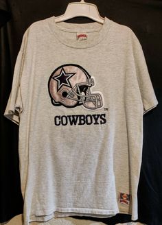 This offering is for a Dallas Cowboys vintage, early 1990's Nutmeg Mills embroidered T-shirt. The shirt is an Extra Large but fits more like a Large, is pre-owned, is in gently worn condition with limited signs of wear/use.  Please review all of the photos carefully and make your own determination on condition and if it works for you. 90s Style T-shirt For Fan Gear With Crew Neck, 90s Style Crew Neck T-shirt For Fan Gear, 90s Crew Neck T-shirt For Fan Gear, Vintage Dallas Cowboys Shirt, Vintage Nfl Shirts, Vintage Western T-shirt, Cheap Vintage T-shirt For Rodeo, Vintage Rams Shirt, Dress Better