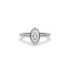 Marquise Diamond Bezel Engagement Ring is made with a marquise cut diamond set in a bezel setting on a solid gold band. Details: - Made to Order- Diamond Weight: 0.25 CT, 0.50 CT, 0.75 CT, 1.00 CT- No. Of Diamonds: 1- Diamond Cut: Marquise- Diamond Type: Lab Grown Diamond (CVD, HPHT)- Diamond Clarity: VS - Diamond Color: Colorless (DEF)- Setting Type: Bezel - Metal Type: 14K Solid Gold,18K Solid Gold- Choice of Gold Color: Yellow Gold, White Gold, Rose Gold - Jewelry Certification: Jewelry price White Gold Marquise Diamond Ring With Bezel Setting, Diamond Marquise Ring With Bezel Setting, Fine Jewelry Marquise Cut Ring With Bezel Setting, Minimalist Marquise Cut Bezel Set Jewelry, Minimalist Marquise Cut Jewelry With Bezel Setting, Marquise Diamond Ring With Bezel Setting For Wedding, 14k White Gold Marquise Rings, Marquise Diamond Ring With Bezel Setting, Modern Marquise Cut Diamond Ring With Bezel Setting