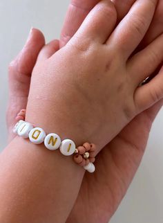 *** NOT sold as a set. Each size sold separately. *** This beautiful Handmade bracelet is a perfect gift for anyone! Mamas, toddlers and children love these bracelets made to last. Order a matching bracelet for you and your little ones. Our Bracelets are Handmade in the USA and are made with high quality 14K gold filled attachments. They are beautiful and add the perfect amount of dress up to every outfit. Each bracelet has extra links for room to grow. This bracelet is handmade to order. We do New Mum Bracelet, Customizable Cute White Jewelry, Cute Customizable White Jewelry, Playful White Custom Name Jewelry, Customized Playful White Jewelry, Cute White Name Bracelet For Mother's Day, Playful Personalized Adjustable Name Bracelet, Playful White Name Bracelet For Personalized Gift, Customizable Cute Name Bracelet Adjustable