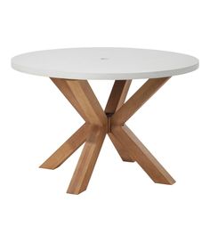 a white table with wooden legs and a circular top on an isolated surface, against a white background