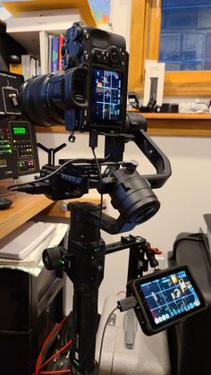 a video camera sitting on top of a tripod