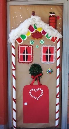 a door decorated to look like a gingerbread house