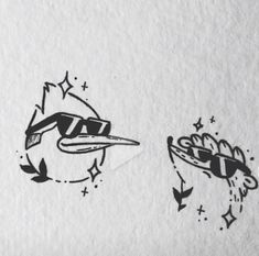 two black and white drawings of birds on paper