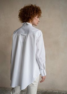 The white oversized button-down shirt Seconda is a timeless wardrobe essential that offers versatility, making it a perfect choice for any occasion. Whether it's a business meeting or a relaxing day, Seconda ensures your comfort with its organic cotton fabric and oversize design. This shirt offers a sense of sophistication and high-quality craftsmanship that you can truly feel when you wear it.Features: Oversized dropped shoulder design Classic collar split in two at the back 3-buttoned cuffs Cu Oversized Button Down Shirt, Shirt Blouses Women's, Business Shirt, Cotton Crafts, Business Shirts, Gifts For New Mums, Pearl Jewellery Earrings, Relaxing Day, Organic Cotton Fabric