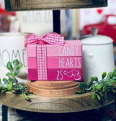 a candy heart box with a pink bow on it sitting on top of a table