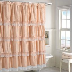 a shower curtain with ruffles and lace on it