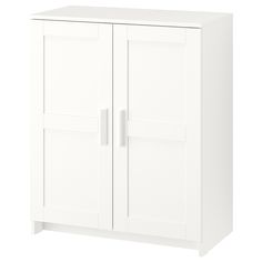 a white cabinet with two doors and drawers