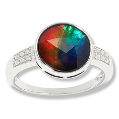 Discover the mesmerizing allure of the Canadian Ammolite Gems Sterling Silver Round Ammolite Ring by Kenneth Bradley. This exquisite piece showcases a vibrant, multicolored Ammolite/Quartz triplet, a rare gemstone known for its dazzling array of natural hues, sourced from Alberta, Canada.

- Material: Sterling Silver (.925) with rhodium plating
- Size: 9
- Color: Silver
- Gemstone: Round 10mm multicolor Ammolite/Quartz triplet, bezel-set
- Design Features: Beaded accents on the ring shoulders, a Ammolite Ring, Ireland Fashion, Original Jewelry Design, Rare Gems, Rare Gemstones, Original Jewelry, Alberta Canada, Gems Jewelry, Natural Colors