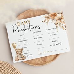 a baby dedication card on top of a wooden plate next to a wicker basket