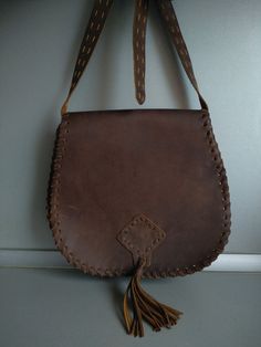 Vintage genuine leather bag - Retro leather bag - Old leather bag from 70' - brown leather bag - Old Genuine Leather Bag - Shoulder bag Beautiful shoulder bag made of genuine leather . For people who love items with history . Dimensions : 28 cm x 29 cm x 10 cm For other GENUINE LEATHER BAG please check here : https://www.etsy.com/shop/TheVINTAGEShopBG?ref=l2-shopheader-name&section_id=22456024 All pictures are real . You buy exactly what you see in the photos . Thank you for visiting my stor Retro Vintage Brown Bag With Leather Backing, Vintage Leather Embossed Shoulder Bag, Vintage Distressed Brown Shoulder Bag With Leather Backing, Vintage Leather Bag, Rectangular Shape, Vintage Brown Vegetable Tanned Leather Bag, Leather Folder, Designer Leather Handbags, Leather Portfolio, Brown Leather Bag