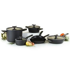 an assortment of black pots and pans