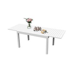 the table is white and has flowers on it