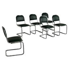 four black leather chairs with chrome frame and backrests, all in different positions