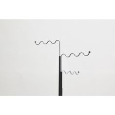 an antenna on top of a pole with two wires attached to it, against a white background