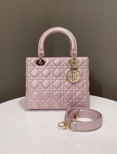 Dior Classic Lady DiorPearl Louts Pink Lambskin GHWMedium 24 x 20 x 12 cmAdjustable StrapYear 20168/10 Good (corners and edge rubs, some marks and scratches on leather, interior almost clean, well structured)Includes dust bag and cardRTP 10,000 sgd Price now 3550 sgd  2660 usd CN6066-01 Outfit School, Designer Shopping, Chain Loop, Rose Gold Hardware, Timeless Handbag, Luxe Fashion, Vuitton Bag, Bags Designer Fashion, Exclusive Bag