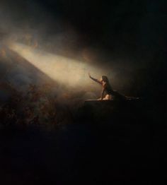 a woman sitting on top of a surfboard in front of a dark background with light coming from behind her