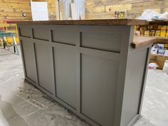 a kitchen island in the process of being painted