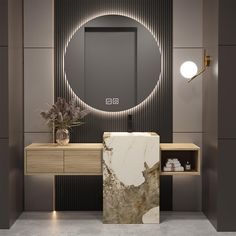 a modern bathroom with marble counter tops and an oval mirror on the wall above it