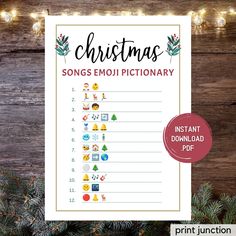 christmas song emojtionary printable with lights and pine branches in the background