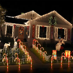 a house covered in christmas lights and decorations