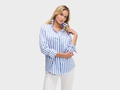 BLUE SATIN & WHITE STRIPE Our menswear inspired Weekend Shirt in a classic blue and white satin stripe. Blue Shirt With Signature Stripes For Work, White Shirt With Signature Stripes For Spring, Spring White Shirt With Signature Stripes, Elegant Shirt With Vertical Stripes For Daywear, Elegant Top With Striped Fold Down Collar, Blue Tops With Signature Stripes For Summer, Elegant Top With Striped Spread Collar, Spring Tops With Vertical Stripes And Spread Collar, Classic Summer Tops With Signature Stripes