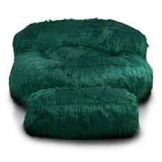 two green furry chairs sitting next to each other