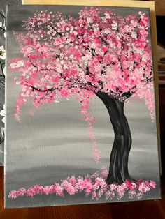 a painting of a tree with pink flowers painted on the bottom half of it and gray background