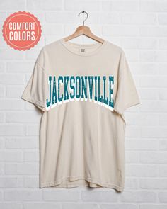 "comfort colors Jacksonville Football shirt, Jacksonville Football Shirt, Retro Jacksonville Football Shirt, Jacksonville Football Gift -Please check Color and Size Charts before placing the order. You can find them in the listing's photos (Depending on what device you are viewing this listing colors may vary slightly). -Returns and exchanges are accepted only if there are defects \"No Extra Costs\" We create custom t-shirts with great designs for everyone's liking. If you don't find the size or color you would like, please message us and we will be happy to  accommodate! comfort colors Jacksonville Football shirt, Jacksonville Football Shirt, Retro Jacksonville Football Shirt, Jacksonville Football Gift PRODUCT T-shirt Comfort Colors® 1717     Medium fabric (6.1 oz/yd² (206.8 g/m     Rela Casual Cotton Shirt For College, Relaxed Fit Cotton Shirt For College, Cotton Graphic Tee Camp Shirt With Letter Print, Cotton Camp Shirt With Letter Print, White Cotton Camp Shirt With Crew Neck, White Cotton Crew Neck Camp Shirt, Credit Card Debit, Football Gifts, Football Shirts