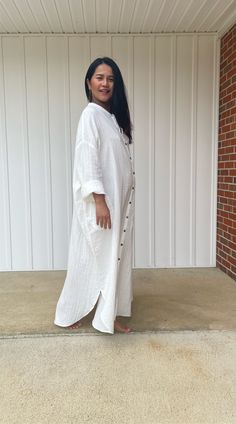 Relax in style with the white Aura shirtdress, a unique take on traditional loungewear. Made from breathable double gauze cotton, it's perfect for casual wear out, at home, or even as a beach coverup. The button-down design adds a touch of style and versatility to your wardrobe, ensuring comfort and convenience as you go about your day. Oversized Button-up Shirt Dress For Beach, Long White Cotton Shirt Dress, White Long Shirt Dress For Summer, White Button-up Shirt Dress For Vacation, White Shirt Dress For Beach Season, White Long Shirt Dress For Daywear, Long Cotton Shirt Dress For Vacation, White Bohemian Shirt Dress For Summer, White Summer Shirt Dress With Buttons