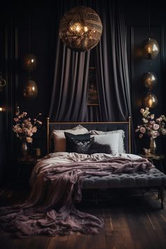 a bed with purple sheets and pillows in a dark room next to a chandelier