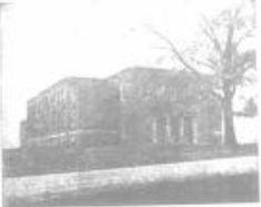 an old black and white photo of a building