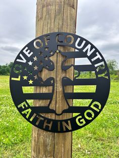 a wooden pole with a sign on it that says, we are county faith in god