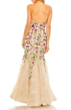 Crystals and beads shimmer across a vibrant floral-embroidered mermaid gown cut from ethereal tulle and lace in a romantic floor-skimming silhouette. Hidden back-zip closure Sweetheart neck Strapless Lined 100% polyester Spot clean Imported Asian Owned/Founded Sheer Bustier, Robe Fuchsia, Champagne Formal Dresses, Blush Prom Dress, Orange Prom Dresses, Enchanting Dress, Modest Formal Dresses, Navy Blue Prom Dresses, Navy Blue Bridesmaid Dresses