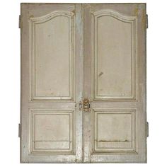 an old white double door with ornate carvings on the front and side panels, isolated against a white background