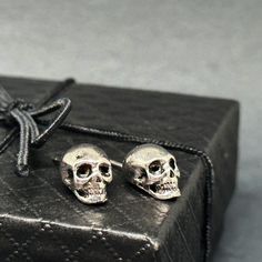 These unisex silver skull studs are a must-have! With intricate designs and a touch of coolness, they make an ideal gift for those who love rock music or embrace the Gothic-Punk-Tattoo fashion. Perfect for any occasion, and great for anyone looking to add some edge to their outfit. And let's not forget about all the avid skull jewelry collectors out there! Don't just take it from me, these earrings are sure to please anyone who receives or wears them. They're a practical and unique gift that will be treasured and worn with pride. Material: BrassType: Stud EarringsColor: Silver/BlackSize: One Size11x8mm(0.43x0.32in)_________________________ • GET IT FAST!Get it fast! Ready to ship on 1 to 3 business days. • ORDER NOW!Limited Quantities / Limited Edition. Thank you for stopping by!__________ Frida Kahlo Earrings, Punk Tattoo, Tattoo Fashion, Mexican Jewelry, Love Rocks, Vintage Punk, Skull Jewelry, Gothic Punk, Skull Earrings