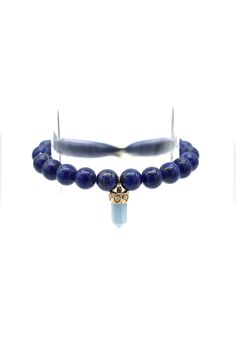 The Short Carved Stone Point Crystal charm features a 14K Yellow Gold cap with Diamonds. The smooth, round beads of the bracelet are made from deep blue Lapis. Slip-on style. Charm dimensions: 0.625"H x 0.25"W Gold Cap, Gold Caps, Carved Stone, Blue Lapis, Crystal Charm, Stone Carving, Deep Blue, Round Beads, Beaded Bracelet