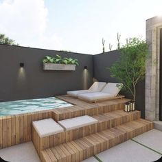 an outdoor pool with steps leading up to it and potted plants on the wall