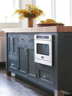 a kitchen island with an oven and sink