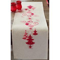 a table runner with christmas trees on it