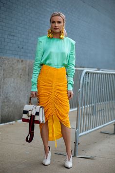 It's Baaack: 'Tis The Season For Street Style #refinery29 Color Blocking Street Style, Colour Street Style, Bold Color Outfits Street Style, Chic Spring Color Block Skirt, Orange Skirt Street Style, New York Street Style, Nyc Street Style, Streetwear Mode, Moda Chic